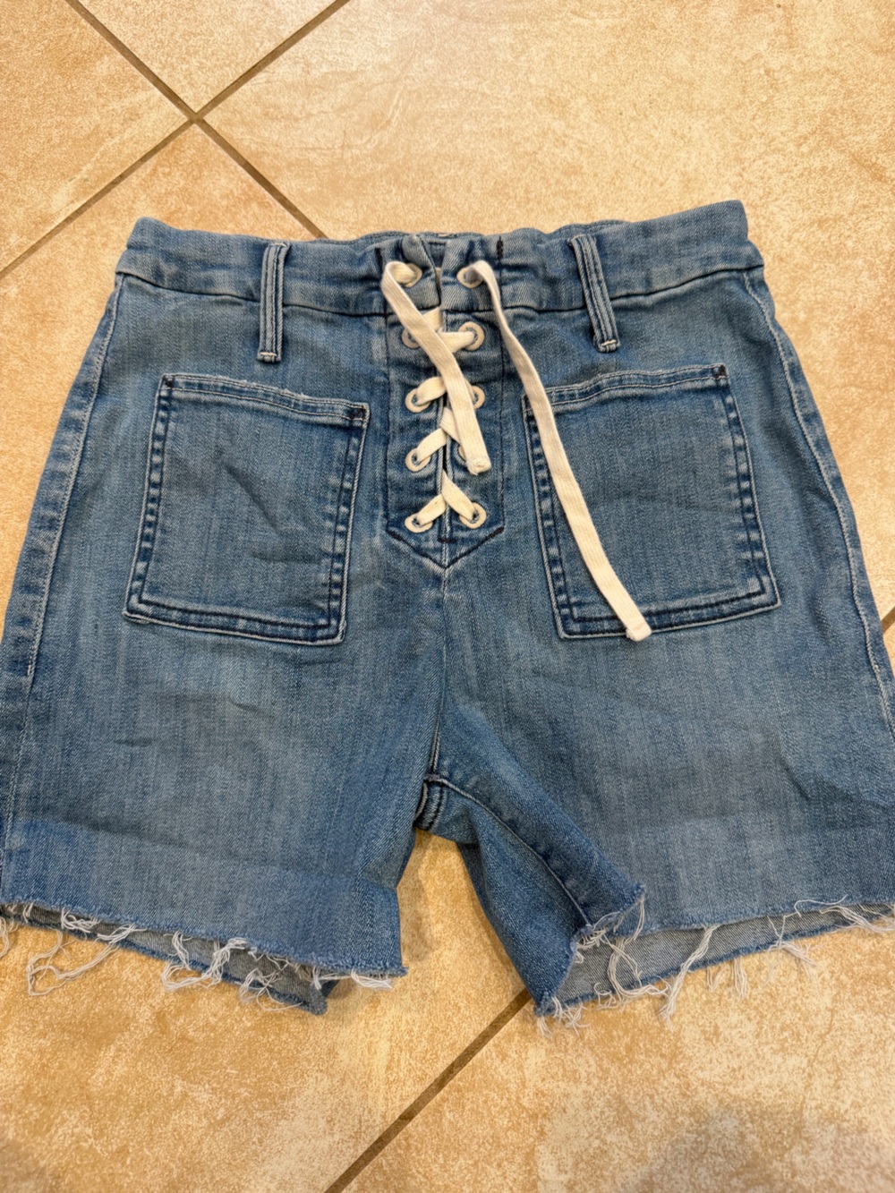 MOTHER women’s Light Blue Lace-Up Denim cut off Shorts size 26